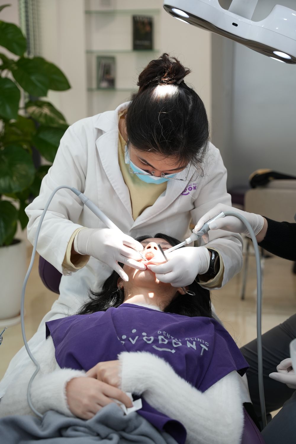 Dentist treating a patient in a modern dental clinic
